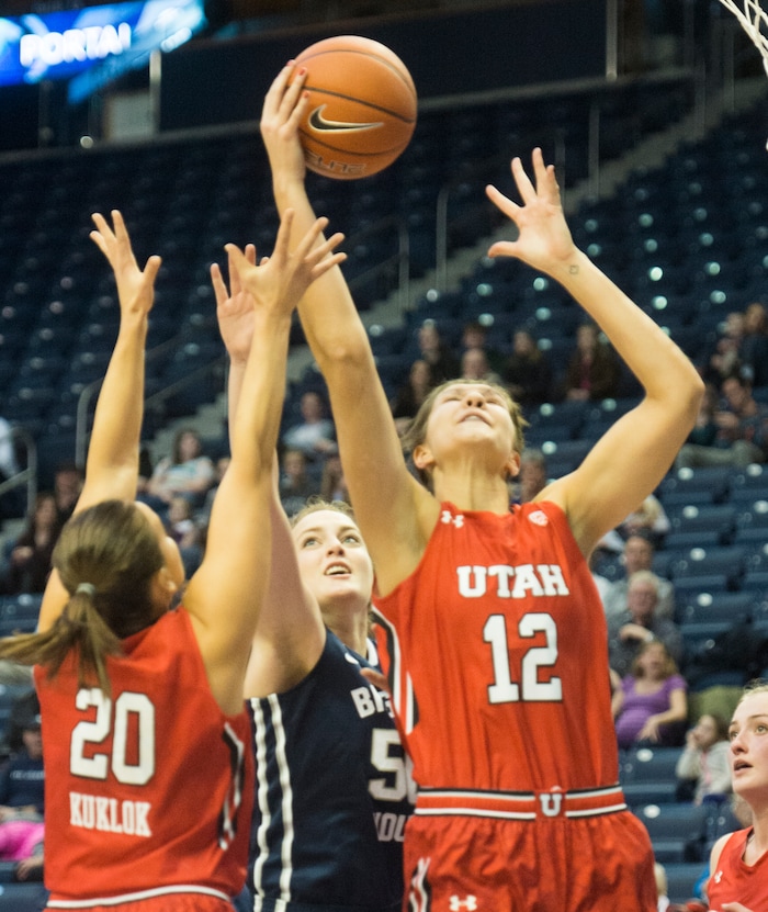 Rick Egan  |  The Salt Lake Tribune

Utah Utes forward Emily Potter (12) grabs a rebound, Brigham Young Cougars center Macayla Hanks (50)in basketball action, BYU vs. Utah, in the Marriott Center, Saturday, December 12, 2015.  
