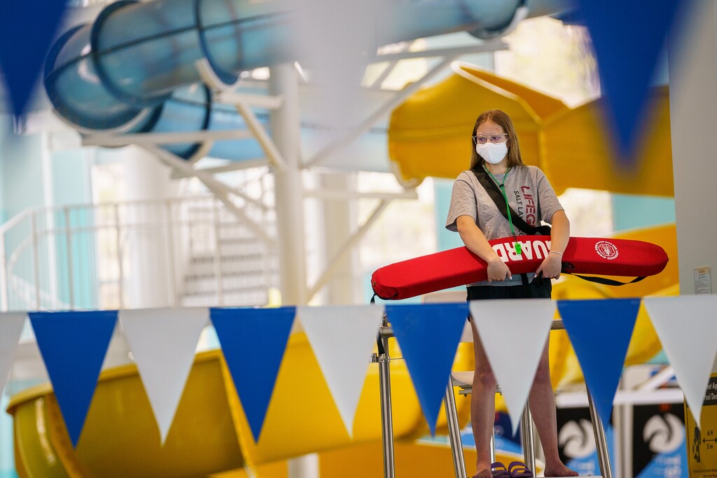 (Trent Nelson  |  The Salt Lake Tribune) Lifeguard Lainey Vander Linden at the Draper Recreation Center on Monday, May 10, 2021. A mask mandate remains in effect at Salt Lake County facilities, though some GOP officeholders are seeking to change that.