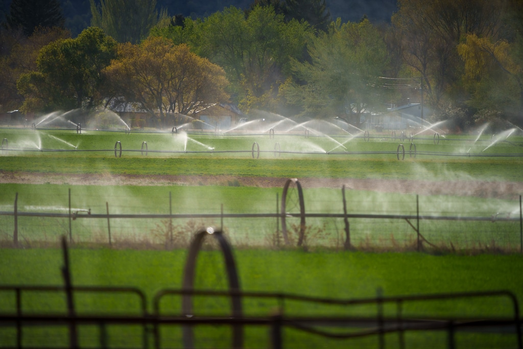 (Trent Nelson  |  The Salt Lake Tribune) A field is watered in Paragonah on Thursday, May 4, 2023.
