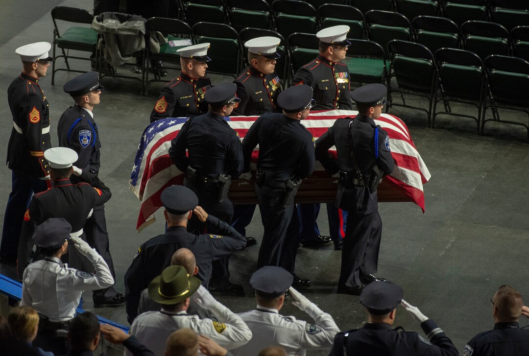 (Rick Egan  |  The Salt Lake Tribune)     The Pall bearers carry the casket into the Maverik Center, for the funeral for South Salt Lake police officer, David Romrell, who died after being struck by a car during a clash with two burglary suspects on Nov. 24. Wednesday, Dec. 5, 2018.