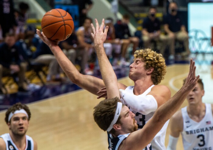 (Rick Egan | The Salt Lake Tribune)  Brigham Young Cougars forward Caleb Lohner (33) draws a foul as he collides with Gonzaga Bulldogs forward Drew Timme (2), in West Coast Conference Basketball action between the Brigham Young Cougars and the Gonzaga Bulldogs at the Marriott Center in Provo, on Monday, Feb. 8, 2021.