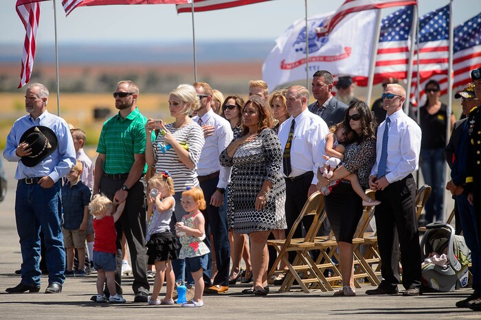 (Trent Nelson | The Salt Lake Tribune)  Family members look on as the body of fallen soldier Aaron Butler, who was killed last week in Afghanistan, arrives at the Monticello Airport, Thursday August 24, 2017.
