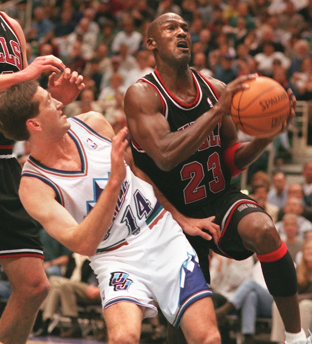 Tribune file photoMichael Jordan goes around Jeff Hornacek during the 1997 NBA Finals.