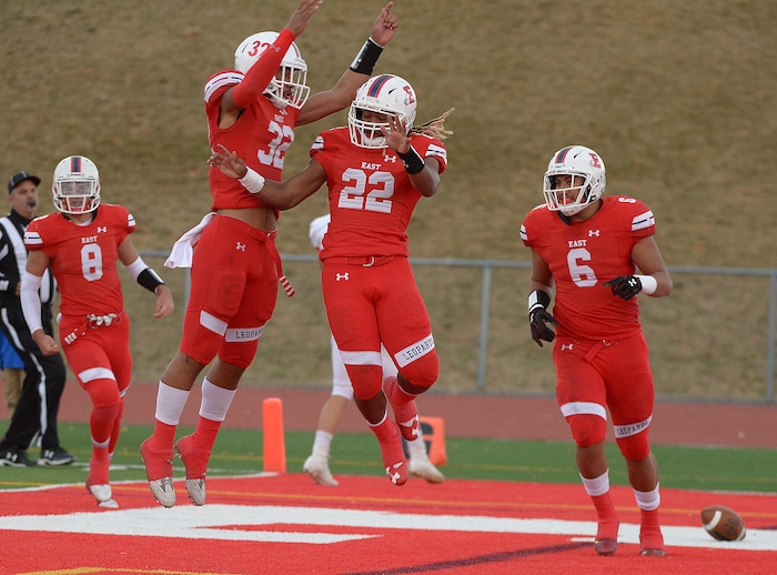 (Leah Hogsten  |  The Salt Lake Tribune) East's Xavier Spann celebrates his touchdown with teammates. American Fork High School boys' football team met East High School during their class 6A state quarterfinal football game, Friday, November 3, 2017