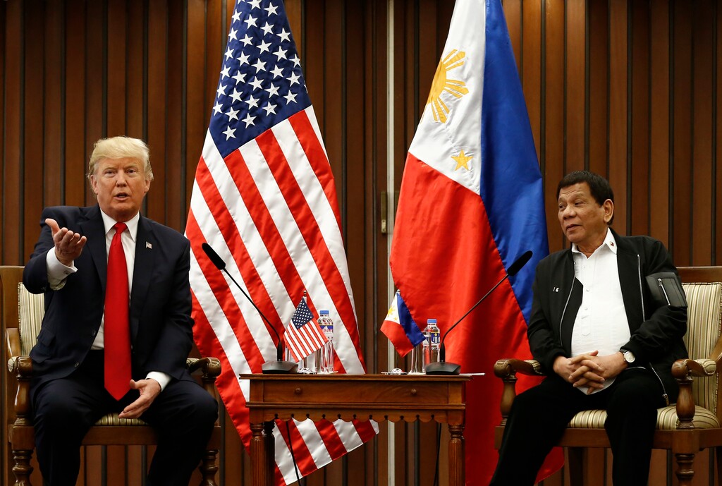 U.S. President Donald Trump, left, gestures beside Philippine President Rodrigo Duterte as they hold a bilateral meeting on the sidelines of the 31st Association of Southeast Asian Nations (ASEAN) Summit and Related Meetings at the Philippine International Convention Center in Manila, Philippines Monday Nov. 13, 2017. (Rolex dela Pena/Pool Photo via AP)