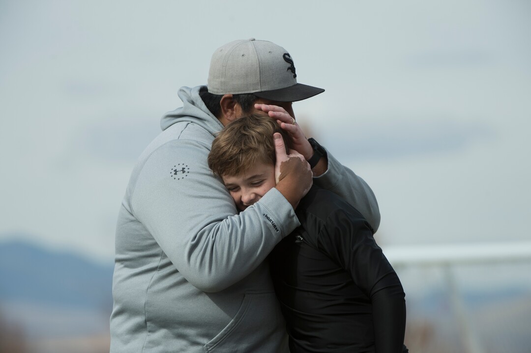 (Rick Egan | The Salt Lake Tribune) Box Elder lacrosse coach Juan Gaytan hugs player Quade Simpson after a tournament in Logan on Saturday, Nov. 3, 2018.