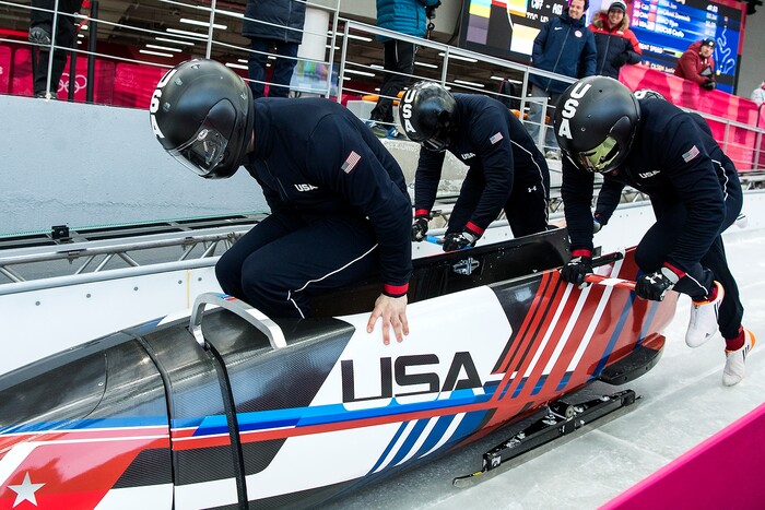 (Chris Detrick  |  The Salt Lake Tribune)  USA's Justin Olsen, Nathan Weber, Carlo Valdes and Chris Fogt jump into the sled at the start during the 4-man Official Training at Olympic Sliding Centre during the Pyeongchang 2018 Winter Olympics Wednesday, Feb. 21, 2018. 