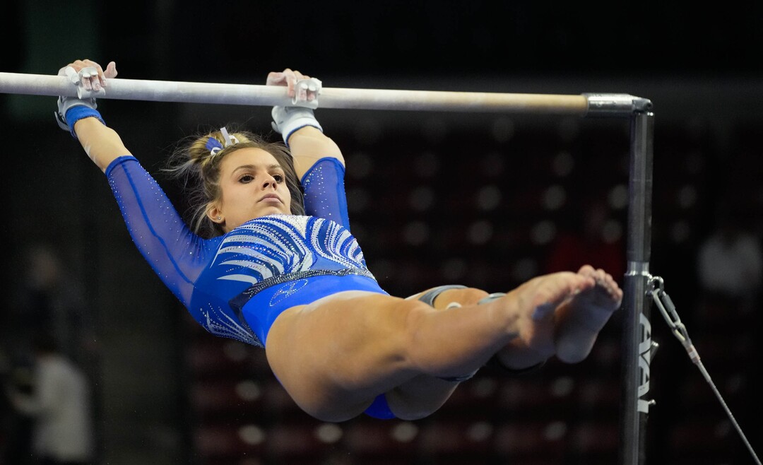 (Francisco Kjolseth | The Salt Lake Tribune) BYU’s Sarah Barron competes on the bars at the Best of Utah NCAA Gymnastics Meet at the Maverik Center in West Valley City on Friday, Jan. 7, 2022.