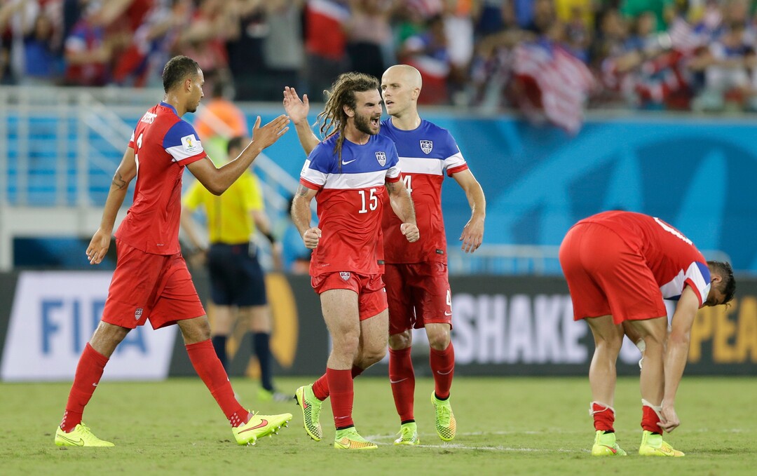 United States players United States' Kyle Beckerman, centre left and teammate Michael Bradley, centre right celebrate after the group G World Cup soccer match between Ghana and the United States at the Arena das Dunas in Natal, Brazil, Monday, June 16, 2014.  The United States won the match 2-1.  (AP Photo/Ricardo Mazalan)