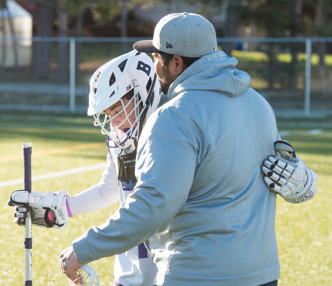 (Rick Egan | The Salt Lake Tribune) Player Seth Linvulle gets a hug from Box Elder lacrosse coach Juan Gaytan during a tournament in Logan on Saturday, Nov. 3, 2018.