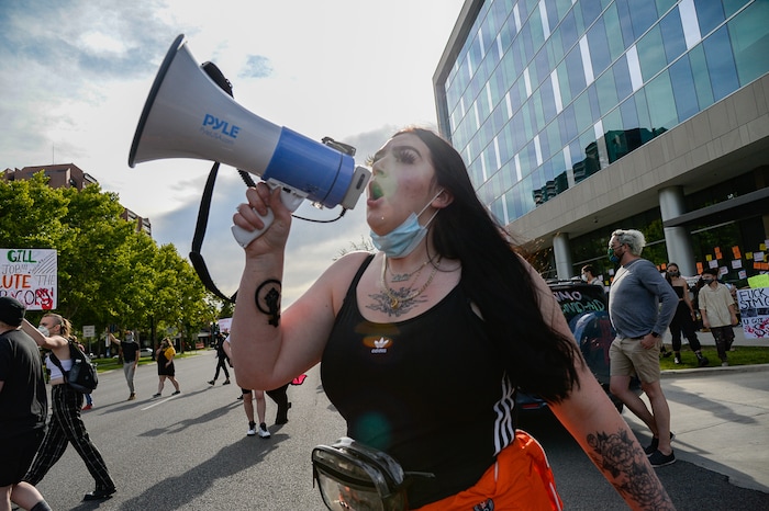 (Francisco Kjolseth  |  The Salt Lake Tribune) Sofia Alcala leads the crowd as they chant during a Rally for Bernardo Palacios, in front of the Salt Lake County District Attorney's office and block traffic along 500 S. on Thursday, June 18, 2020.