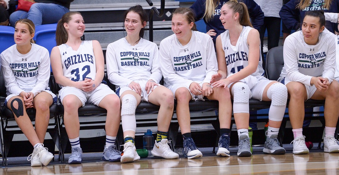 (Leah Hogsten  |  The Salt Lake Tribune)  Copper Hills' starters relax as the second string takes the court.   Copper Hills High School girls' basketball team defeated Pleasant Grove High School 66-25 during their Class 6A girls' basketball playoff opener at Salt Lake Community College Tuesday, Feb. 20, 2018. 