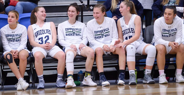 (Leah Hogsten  |  The Salt Lake Tribune)  Copper Hills' starters relax as the second string takes the court.   Copper Hills High School girls' basketball team defeated Pleasant Grove High School 66-25 during their Class 6A girls' basketball playoff opener at Salt Lake Community College Tuesday, Feb. 20, 2018. 
