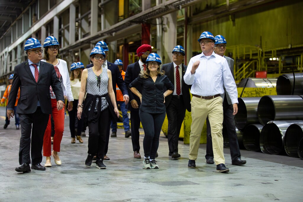 Chrystia Freeland, second from right, Minister of Foreign Affairs, tours Stelco in Hamilton, Ontario, Friday, June 29, 2018. Canada announced billions of dollars in retaliatory tariffs against the U.S. on Friday in a tit for tat response to the Trump administration's duties on Canadian steel and aluminum. (Peter Power/The Canadian Press via AP)