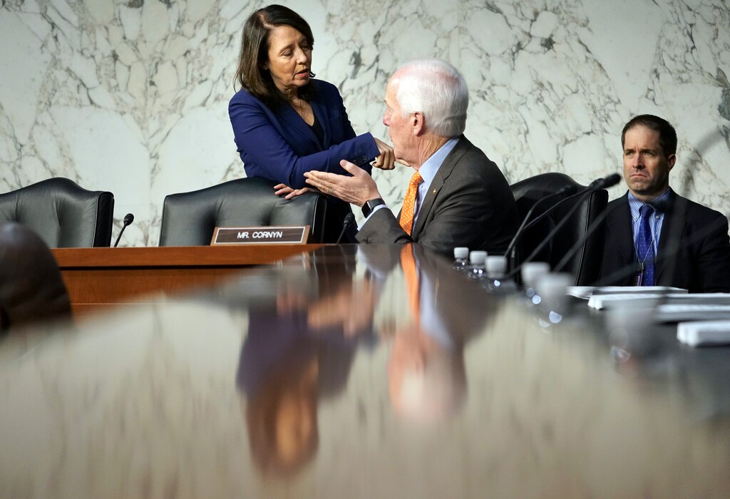 Sen. Maria Cantwell, D-Wash., and Sen. John Cornyn, R-Texas, talk before the start of panel of the Senate Finance Committee begins work on overhauling the nation's tax code, on Capitol Hill in Washington, Monday, Nov. 13, 2017. The legislation in the House and Senate carries high political stakes for President Donald Trump and Republican leaders in Congress, who view passage of tax cuts as critical to the GOP's success at the polls next year. (AP Photo/Pablo Martinez Monsivais)