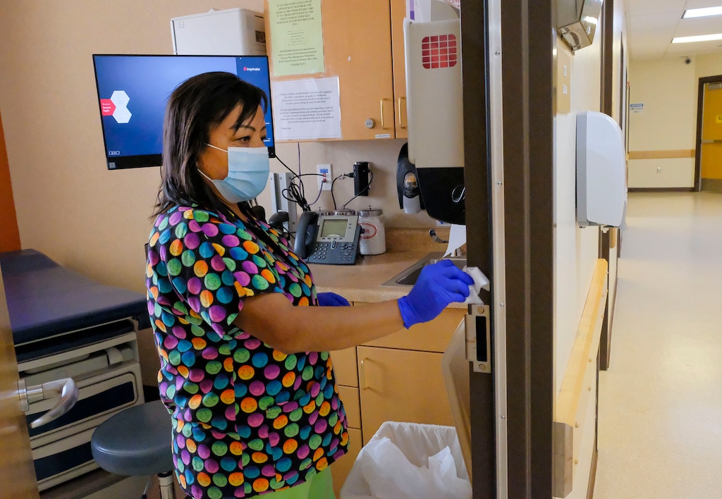 (Leah Hogsten  |  The Salt Lake Tribune) Monument Valley Health Clinic nurse Ernestine Harrison disinfects and wipes down the clinic's treatment rooms, Aug., 24, 2020.