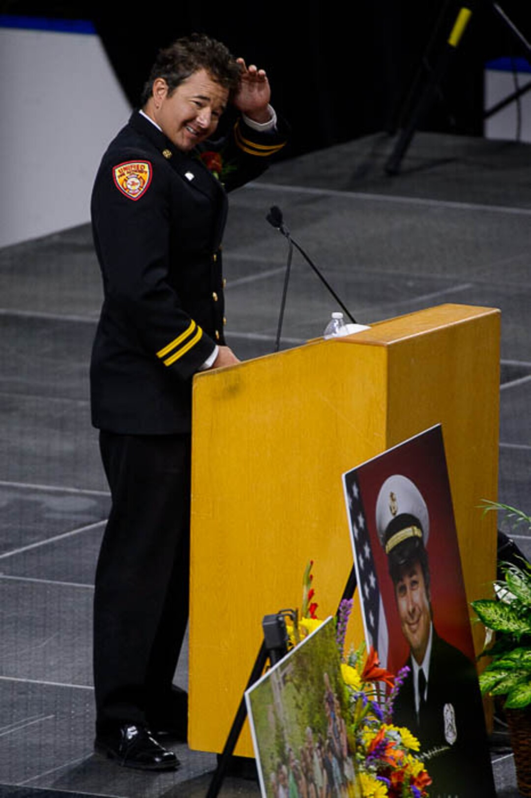 (Trent Nelson | The Salt Lake Tribune)  Dominic Burchett (brother) ruffles his hair while speaking at the funeral services for Battalion Chief Matthew Burchett at the Maverik Center in West Valley City, Monday Aug. 20, 2018.