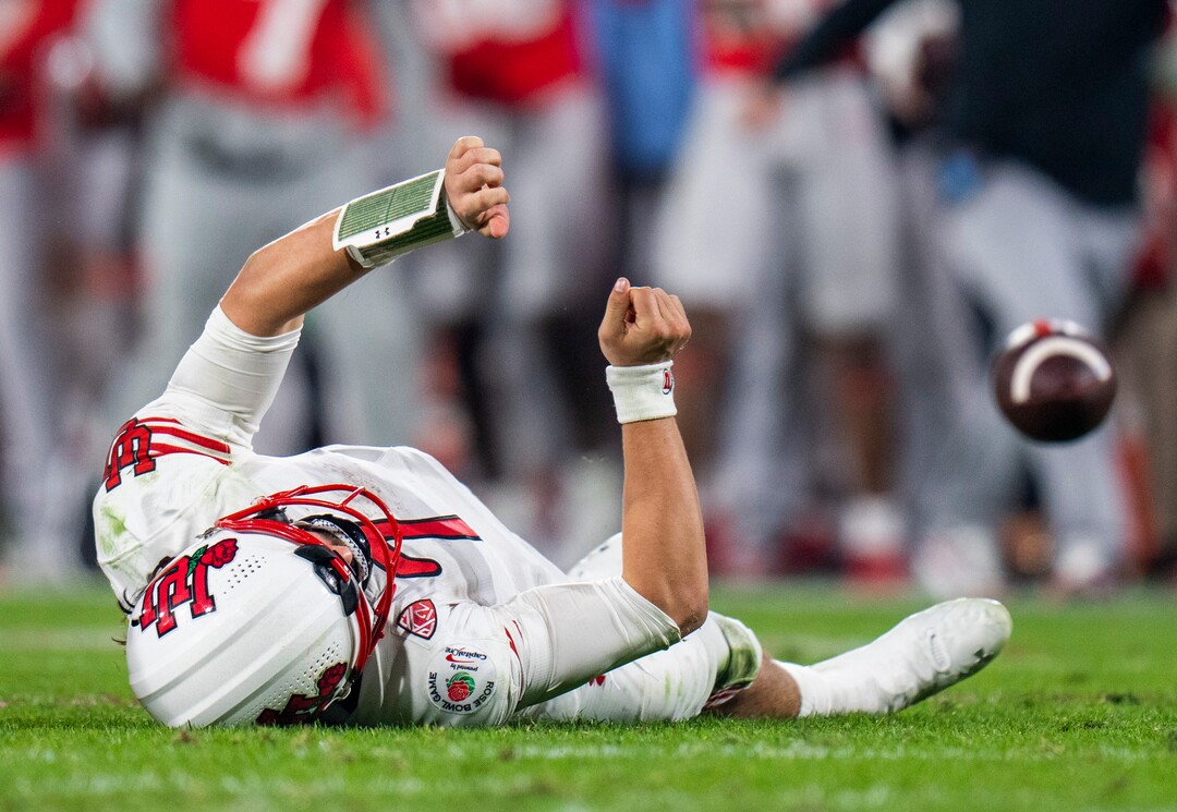 (Rick Egan | The Salt Lake Tribune) Utah quarterback Cameron Rising (7) hit the ground hard, after being brought down Ohio State Buckeyes safety Kourt Williams II as he tries to get rid of the ball. Rising was shaken up on the play as was taken out of the game after the play, in Rose Bowl action between the  Utah Utes and the Ohio State Buckeyes Pasadena, on Saturday, January 1, 2022.