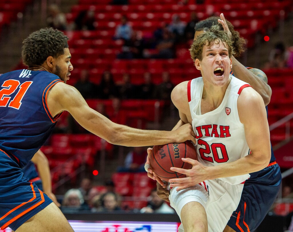 (Rick Egan  |  The Salt Lake Tribune)      Utah Utes forward Mikael Jantunen (20) is slowed down by University of Texas at Tyler Patriots Lense Ramey (21) as he goes to the hoop, in basketball action between the Utes and the University of Texas at Tyler Patriots, at the Jon M. Huntsman Center, Oct. 30, 2019.