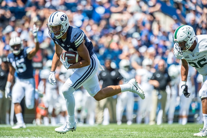 (Chris Detrick  |  The Salt Lake Tribune)  Brigham Young Cougars wide receiver Neil Pau'u (84) runs for a touchdown past Portland State Vikings linebacker Sam Bodine (36) during the game at LaVell Edwards Stadium Saturday, August 26, 2017.