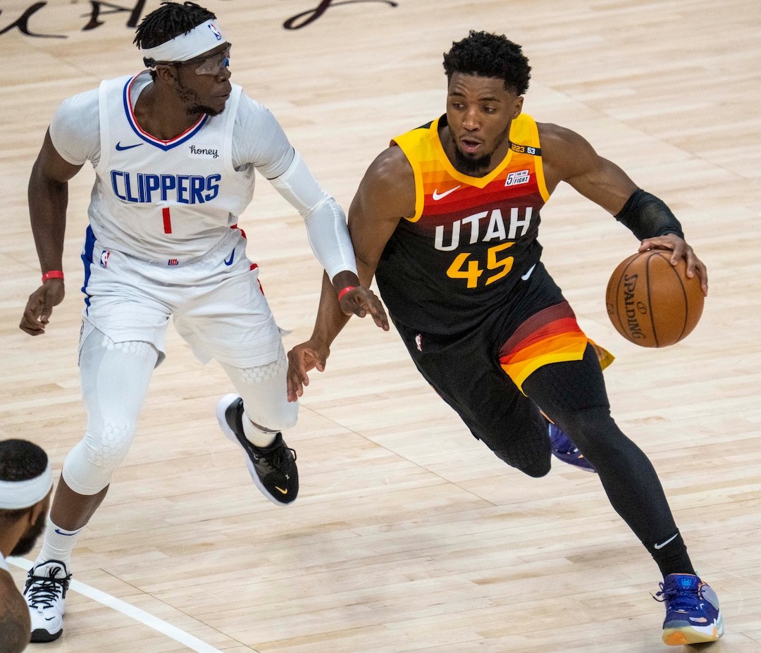 (Rick Egan | The Salt Lake Tribune) LA Clippers guard Reggie Jackson (1) defends Utah Jazz guard Donovan Mitchell (45) in Game 2 of the Western Conference Semifinals at Vivint Arena, on Thursday, June 10, 2021.