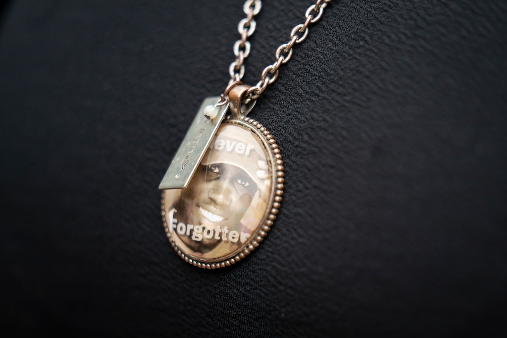 (Nicole Craine | The New York Times)

Thea Brooks, aunt of Ahmaud Arbery, wears a necklace with his photo with the words "Never Forgotten" at Glynn County Courthouse in Brunswick, Ga., Nov. 5, 2021.