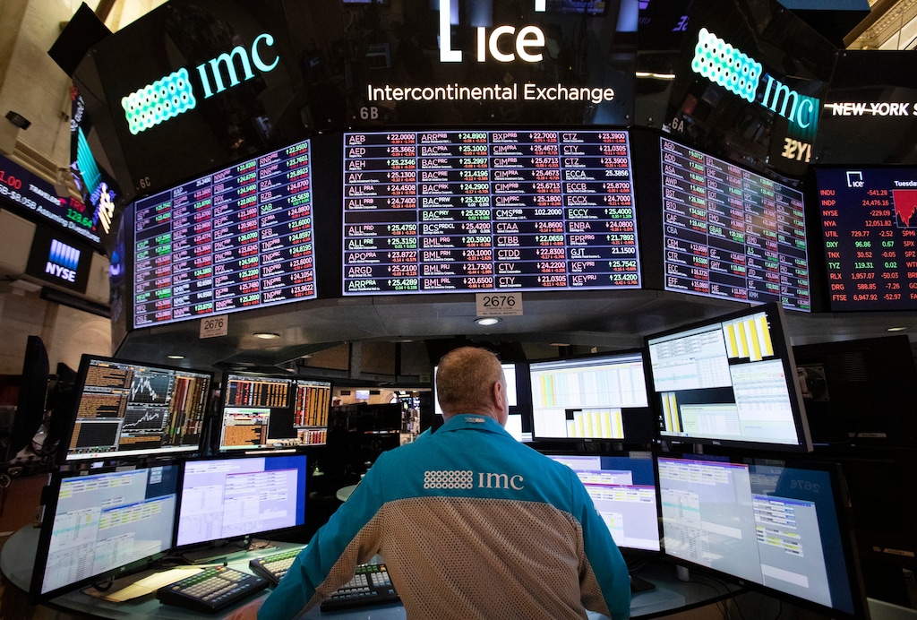 FILE - In this Tuesday, Nov. 20, 2018, file photo, a trader works at the New York Stock Exchange. Corporations' appetite for buying back their own stock has hit a record high. Stock buybacks by companies in the S&P 500 climbed to $194.07 billion in the third quarter, according to data from S&P Dow Jones Indices. (AP Photo/Mark Lennihan, File)