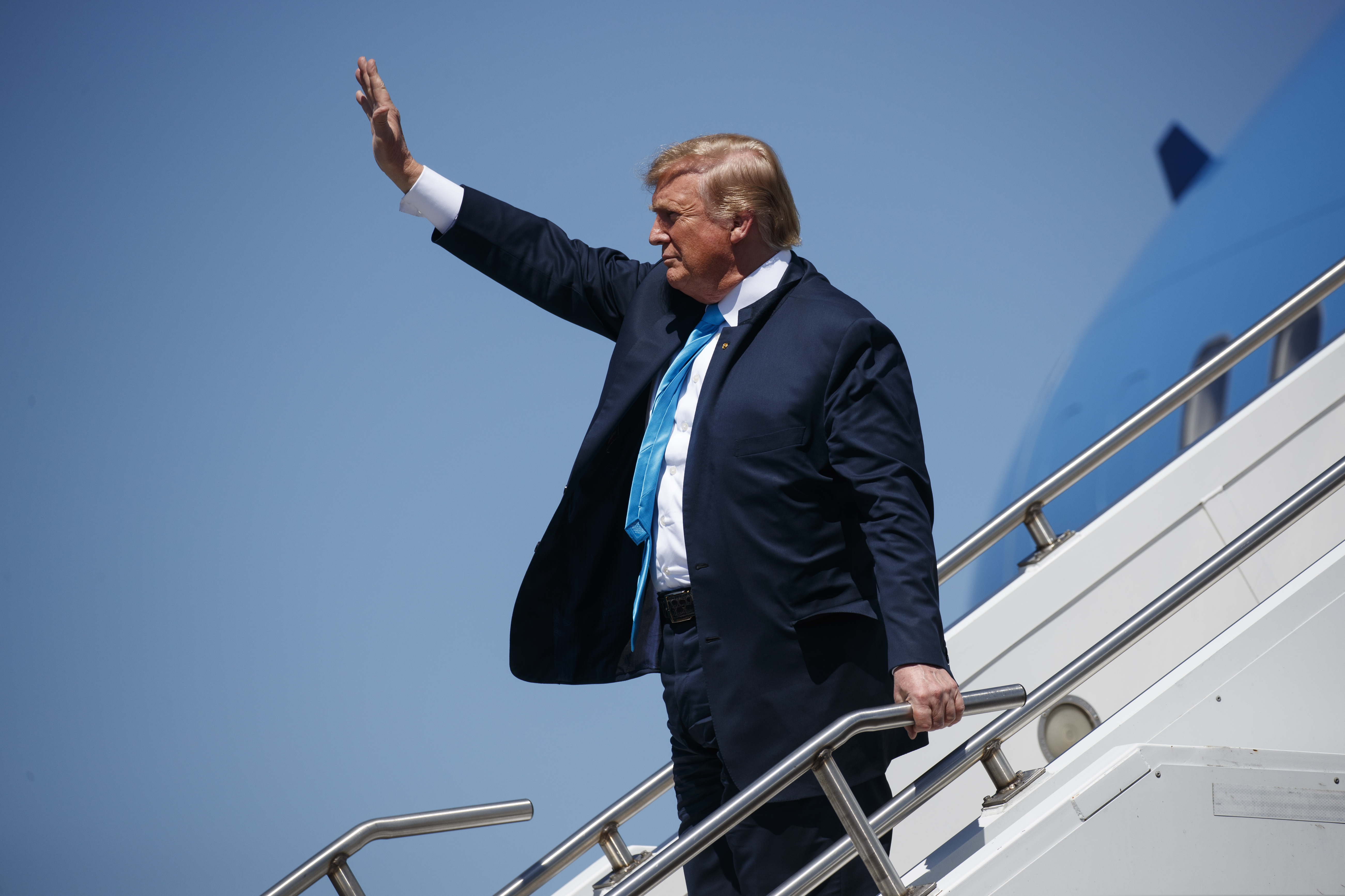 (Evan Vucci | The Associated Press) President Donald Trump waves as he arrives at Ellington Joint Reserve Base, Wednesday, April 10, 2019, in Houston.
