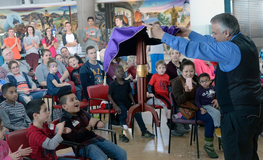 Al Hartmann  |  The Salt Lake TribuneMagician Mike Hamilton surprises patients and their family members at Shriners Hospital New Year's celebration Friday Dec. 30 with a magic table illusion  The wintery affair featured the magic show, winter-inspired crafts, bow and foam arrow archery range, New Year’s hats and blowers, a teddy bear clinic and surprise appearance by Frozen princesses Elsa and Anna. 