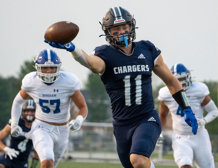 (Rick Egan | The Salt Lake Tribune) Corner Canyon wide receiver Jett Meine (11) runs for a touchdown for the Chargers, in prep football action between the Corner Canyon Chargers and the Bingham Miners, on Friday, Aug. 27, 2021.