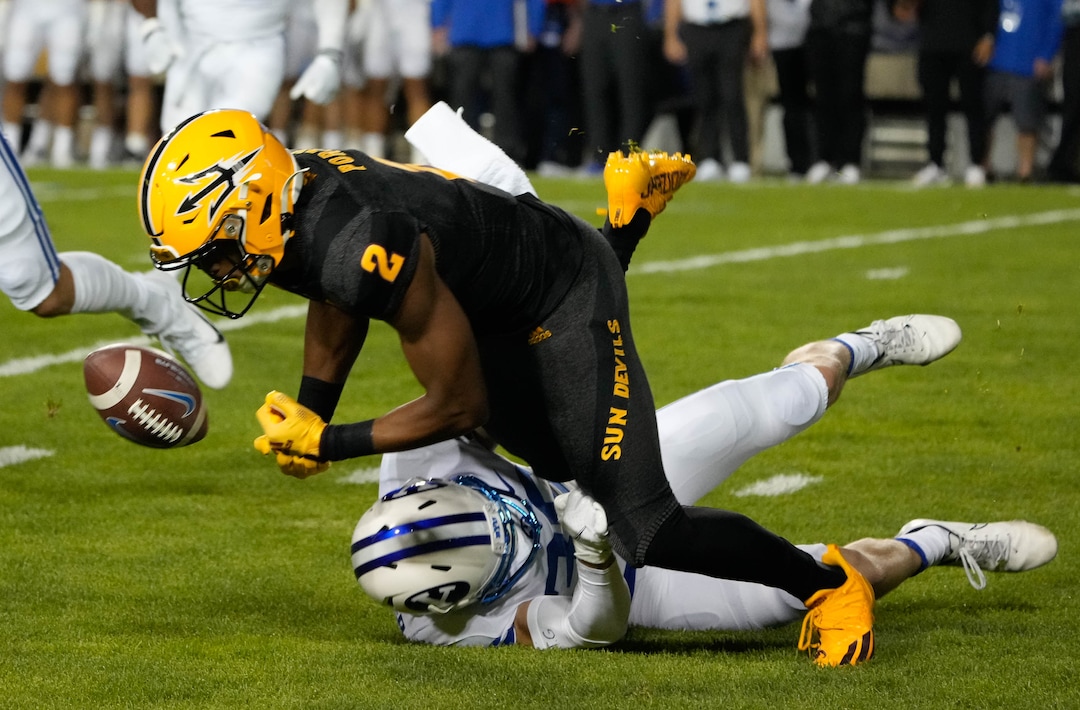 (Francisco Kjolseth | The Salt Lake Tribune) Arizona State Sun Devils wide receiver Geordon Porter (2) is taken down by Brigham Young Cougars wide receiver Talmage Gunther to force a fumble on a kick return at the start of the game in game action between the Brigham Young Cougars and the Arizona State Sun Devils at LaVell Edwards Stadium in Provo, on Saturday, Sept. 18, 2021.
