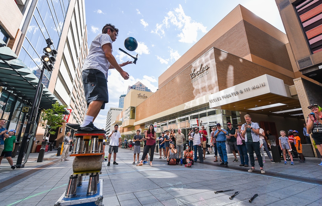 (Francisco Kjolseth  |  The Salt Lake Tribune)  Brent Fiasco juggles a bowling ball, hatchet and sock as the Salt Lake Arts Council presents the first Busker Fest, featuring entertainers, dancers, musicians, magicians, jugglers, and comedy to celebrate the tradition of street performance and observe the city's vaudeville roots along Regent Street in downtown Salt Lake City on Friday, Aug. 24, 2018.