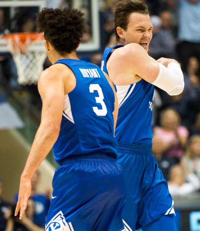 (Rick Egan  |  The Salt Lake Tribune)    Brigham Young guard Elijah Bryant (3) and forward Payton Dastrup (15) react after Daastrup hit another 3-point shot to extend the Cougars lead, in basketball action Utah Utes vs. Brigham Young Cougars at the Marriott Center in Provo, Saturday, December 15, 2017.



