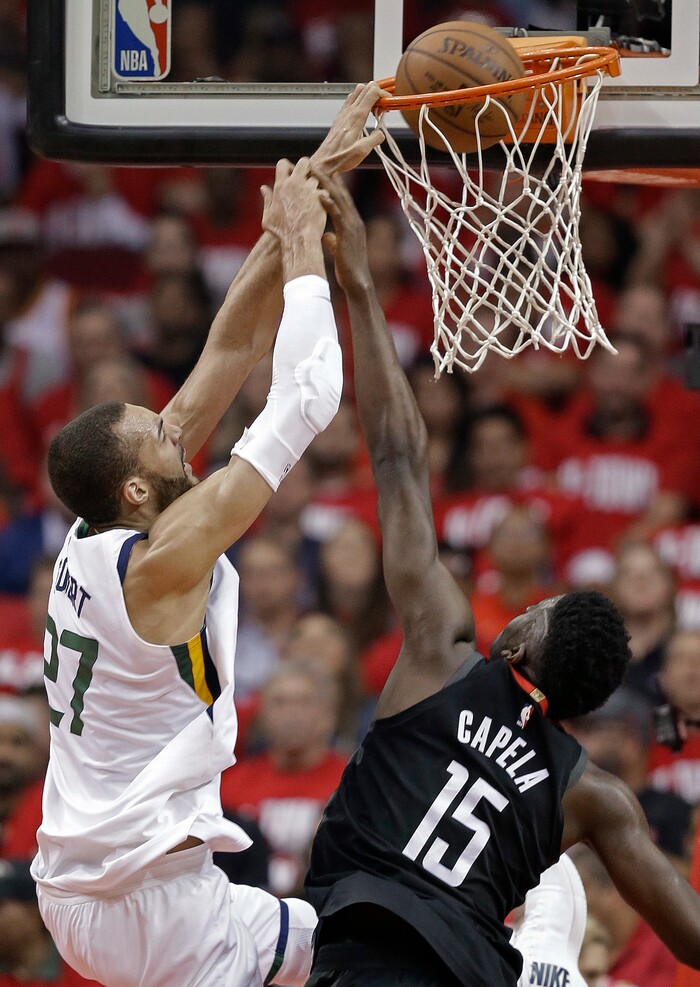 Utah Jazz center Rudy Gobert, left, dunks as Houston Rockets center Clint Capela (15) defends during the first half in Game 2 of an NBA basketball second-round playoff series, Wednesday, May 2, 2018, in Houston. (AP Photo/Eric Christian Smith)