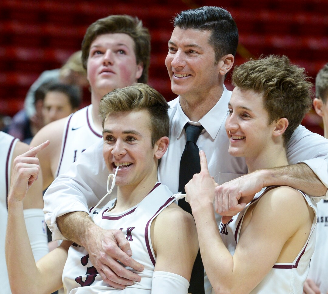 (Leah Hogsten  |  The Salt Lake Tribune) Lone Peak's head coach David Evans celebrates the win with Lone Peak's Steven Ashworth (03) and Lone Peak's Chantry Ross (00). Lone Peak defeated Pleasant Grove 61-44 to win the 6A High School Boys’ Basketball Tournament Championship at the Jon M. Huntsman Center in Salt Lake City, Saturday, March 3, 2018. 