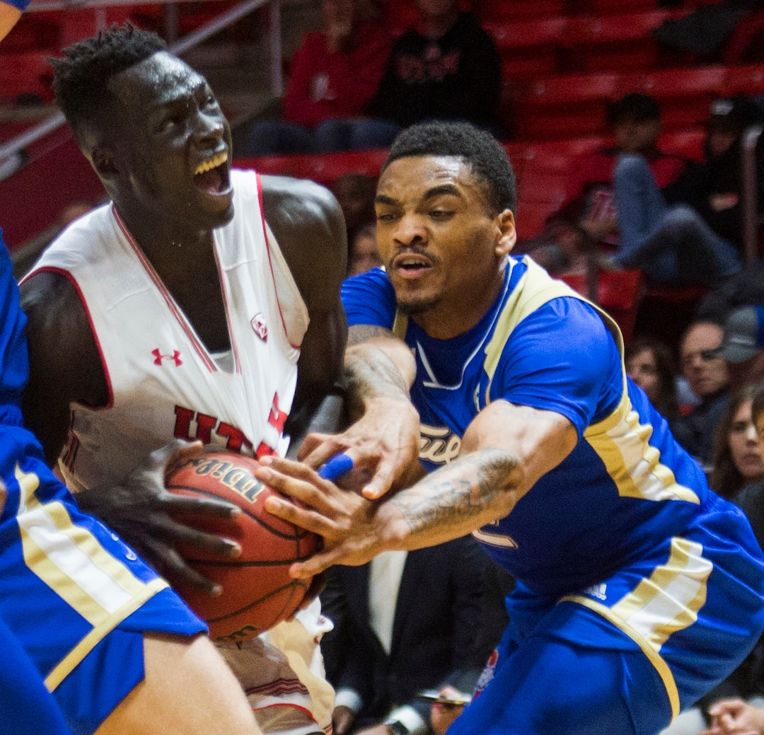 (Rick Egan  |  The Salt Lake Tribune)        Tulsa Golden Hurricane guard DaQuan Jeffries (2) strips the ball from Utah Utes forward Both Gach (11), in basketball action between, Utah Utes and Tulsa Golden Hurricane, at the Jon M. Huntsman Center, Saturday, Dec. 1, 2018.