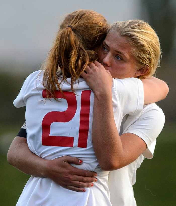 (Steve Griffin | The Salt Lake Tribune) East's Sami Black, right, embraces teammate Ilona Wall as the Leopards are defeated by Maple Mountain in a shootout in the 5A semifinal girl's soccer match at Juan Diego High School in Draper Tuesday October 17, 2017.