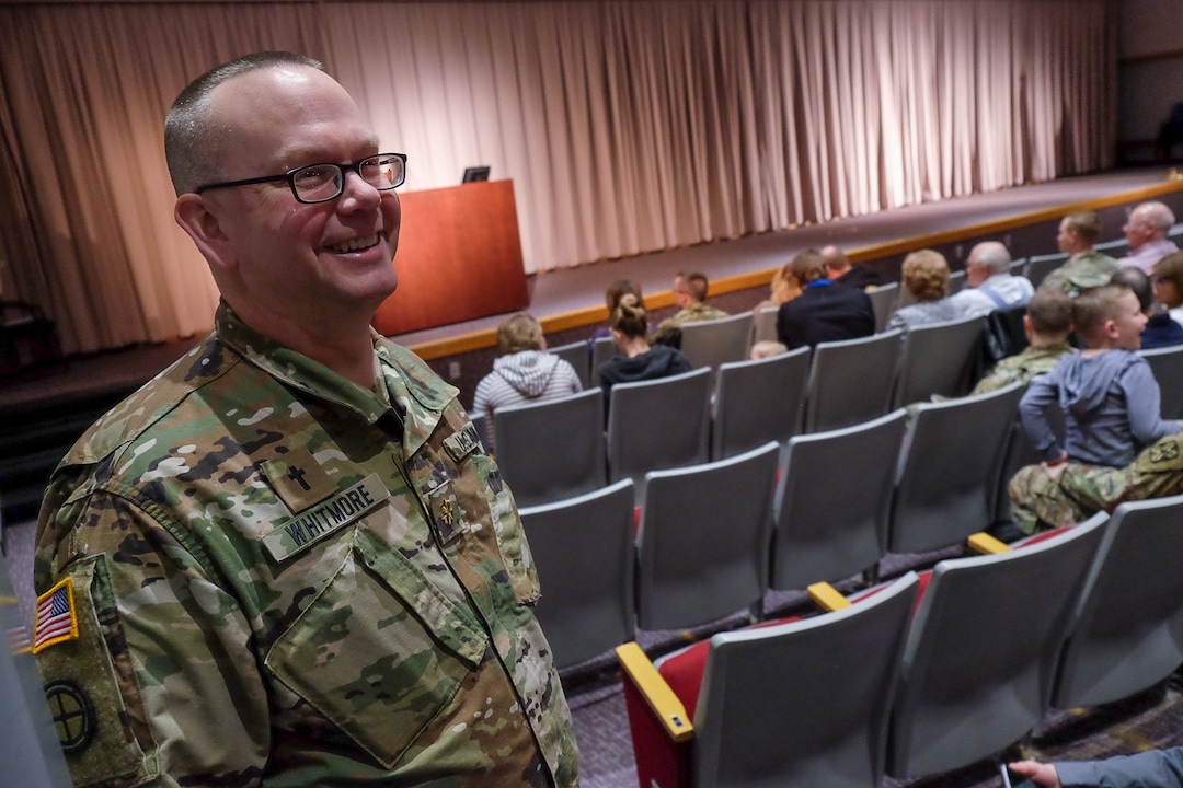 (Francisco Kjolseth  |  The Salt Lake Tribune)   Chaplain Maj. Gene Whitmore greets service men of the 141st Military Intelligence Battalion as they arrive with their family to the Utah National Guard headquarters in Draper on Monday, March 19, 2018, for a departure ceremony. 