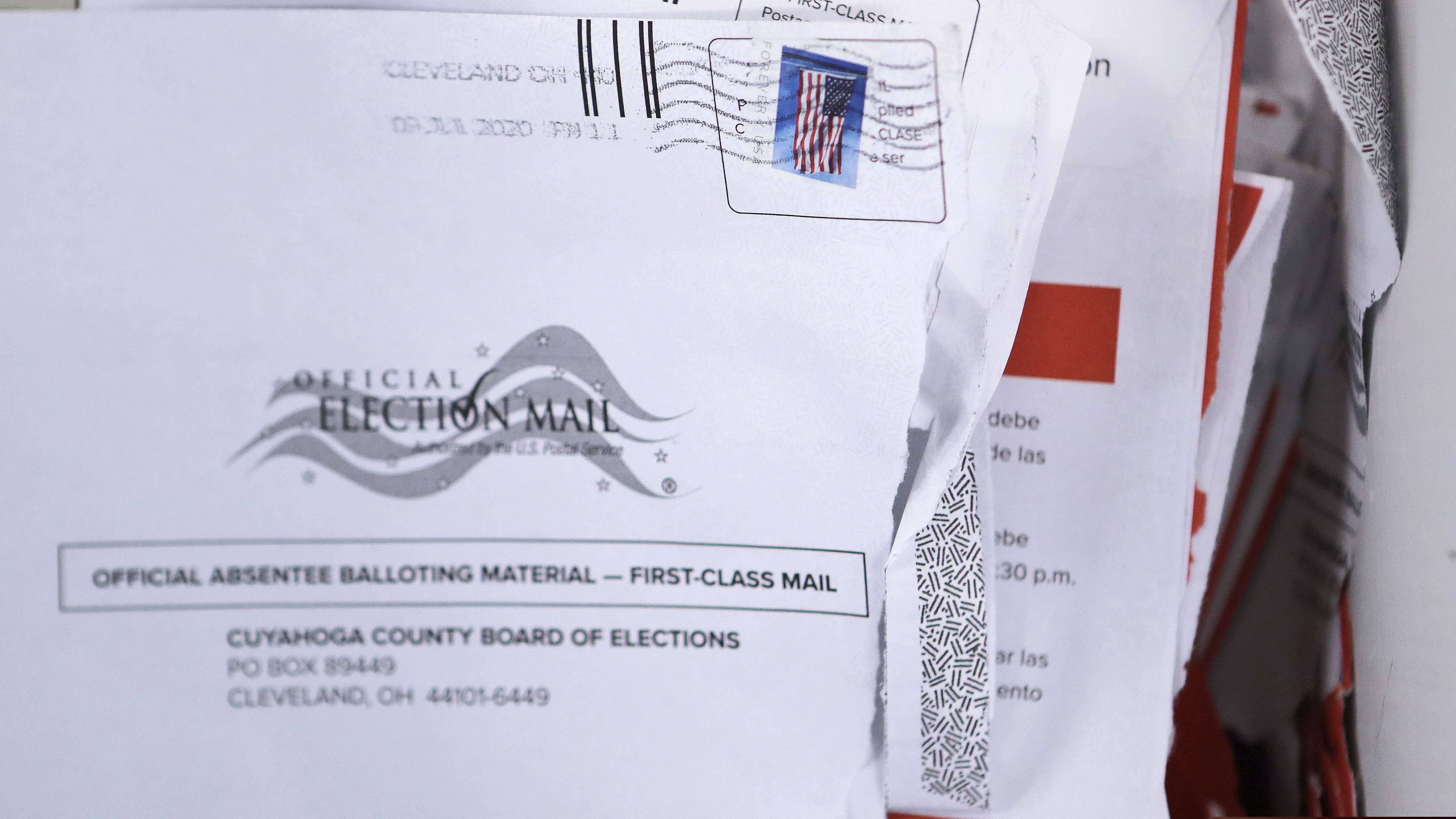 (Tony Dejak | AP file photo) Applications for voter ballots are seen at the Cuyahoga County Board of Elections Tuesday, July 14, 2020, in Cleveland.