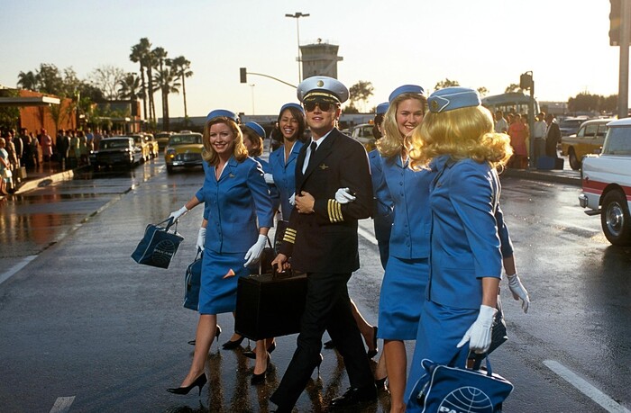 Leonardo DiCaprio (center) plays Frank Abagnale, a con artist who used the guise of a Pan Am pilot as one of his tricks, in the 2002 caper movie "Catch Me If You Can." (Photo courtesy Dreamworks SKG)