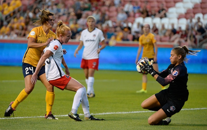 (Francisco Kjolseth  |  The Salt Lake Tribune)  Utah Royals FC hosts Washington Spirit, NWSL soccer at Rio Tinto Stadium in Sandy, Wed. Aug. 8, 2018. Utah Royals FC forward Katie Stengel (24) is blocked by Washington Spirit midfielder Tori Huster (23) during a drive against Washington Spirit goalkeeper Aubrey Bledsoe (1). 