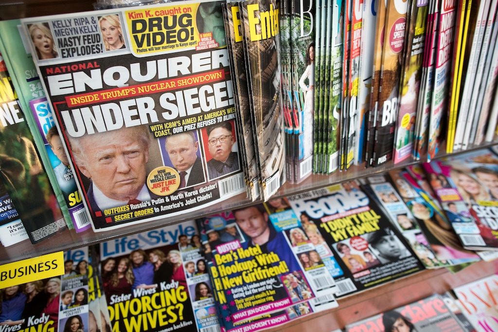 (AP Photo/Mary Altaffer, File) In this July 12, 2017 file photo, an issue of the National Enquirer featuring President Donald Trump on its cover is displayed on a newsstand in a store in New York. The tabloid's owner, American Media announced Thursday, April 18, 2019, that it is selling the supermarket weekly to James Cohen, the former head of the airport newsstand company Hudson News.