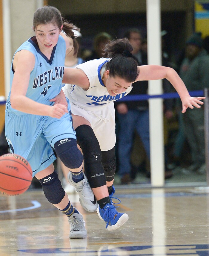 (Leah Hogsten  |  The Salt Lake Tribune) Westlake's Ashley Parry (04) pulls in the ball before Fremont's Mazzie Melaney (15).  Fremont faces Westlake in their semifinal game of the 6A High School Girls' Basketball Tournament at SLCC in Taylorsville, Friday, Feb. 23, 2018. 