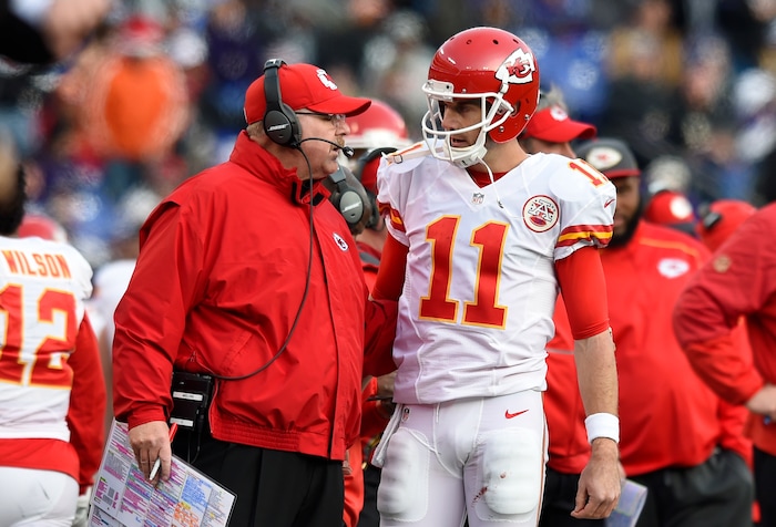 Kansas City Chiefs head coach Andy Reid, left, speaks with Kansas City Chiefs quarterback Alex Smith on the sideline in the second half of an NFL football game against the Baltimore Ravens, Sunday, Dec. 20, 2015, in Baltimore. (AP Photo/Gail Burton)