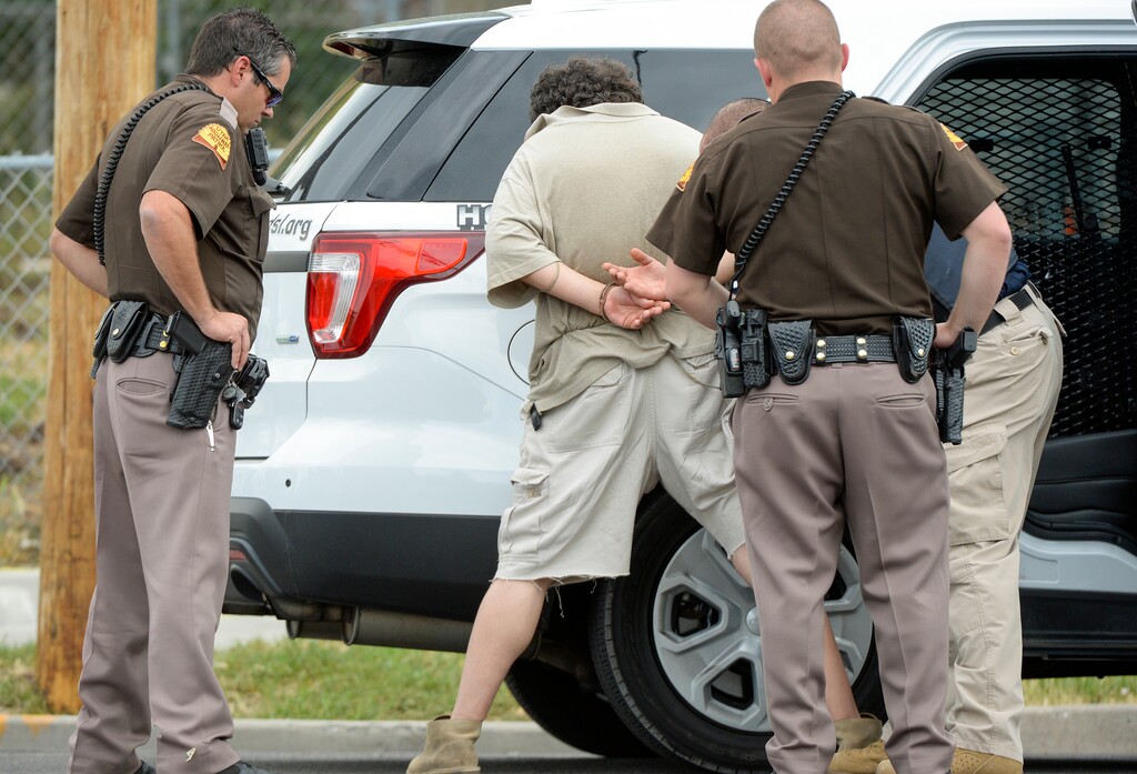 (Chris Samuels | The Salt Lake Tribune) A suspect is taken into custody after police responded to a confrontation at a yoga studio on 700 East in Salt Lake City, Wednesday, June 29, 2022.