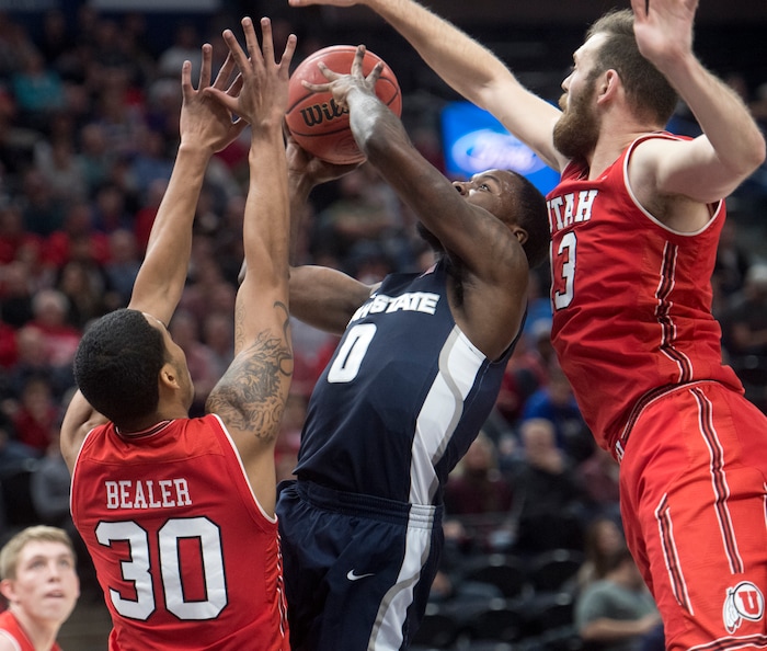 (Rick Egan  |  The Salt Lake Tribune) Utah Utes guard Gabe Bealer (30) and Utah Utes forward David Collette (13) guard State Aggies guard DeAngelo Isby (0), in Beehive Classic basketball action at the Vivint SmartHome Arena, Saturday, December 9, 2017.