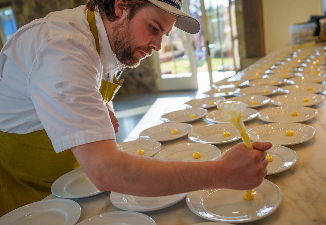 (Trent Nelson  |  The Salt Lake Tribune) Adam Cold prepares plates at Snuck Farm in Pleasant Grove on Thursday, March 24, 2022.