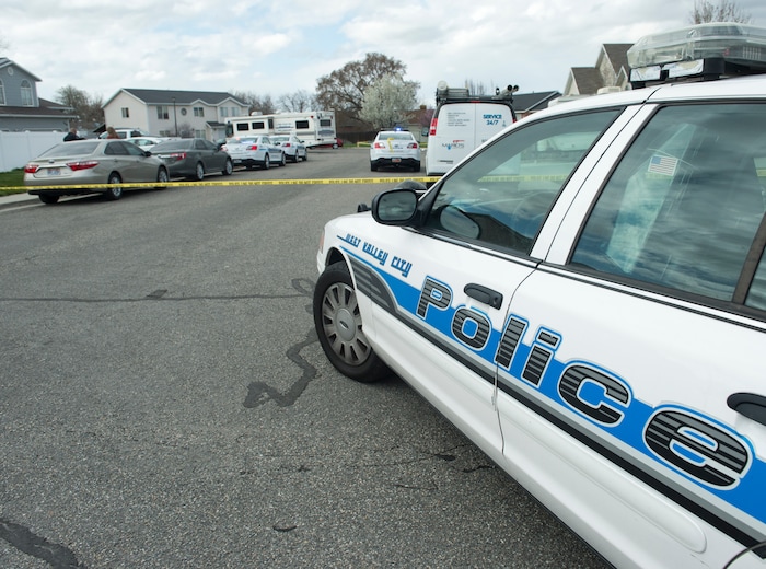 (Rick Egan | The Salt Lake Tribune) Place block the Janell Bay cul-de-sac, as Investigators from West Valley and Unified Police investigate an officer involved shooting, leaving the suspect dead, in West Valley City, Sunday, April 8, 2018.