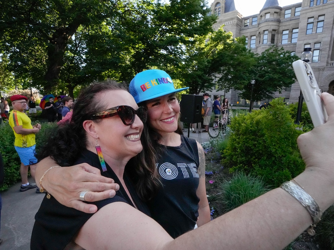 (Francisco Kjolseth  | The Salt Lake Tribune) Chelsie Acosta takes a selfie with Salt Lake City Mayor Erin Mendenhall during the annual raising of the pride flag at City Hall to kickstart a month of festivities for Utah Pride on Friday, May 30, 2025. It is especially notable this year given the state tried to stop the pride flag from flying over government grounds.