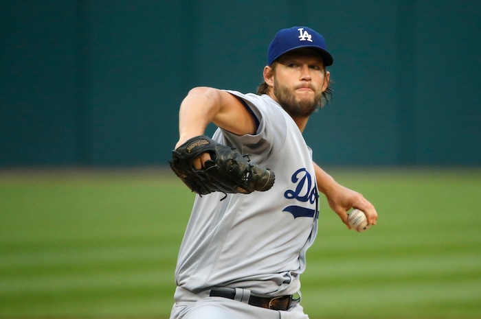 Los Angeles Dodgers starting pitcher Clayton Kershaw winds up during the first inning of the team's baseball game against the Chicago White Sox on Tuesday, July 18, 2017, in Chicago. (AP Photo/Charles Rex Arbogast)